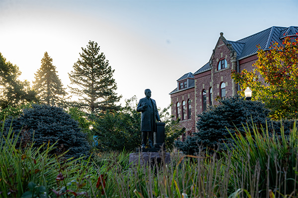 Dakota State University campus image of the General Beadle statue with Beadle Hall behind the statue.